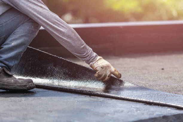 Professional Basement Waterproofing technician working in Arlington, KS